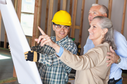 Image of contractor and couple working
